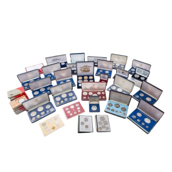 Medium-sized plastic box with Franklin Mint coin sets,