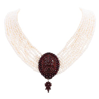 Pearl necklace with antique jewelry pieces,