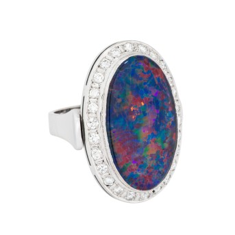 Ring with large opal triplet surrounded by diamonds,