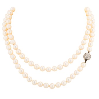 Long pearl necklace with diamond clasp,