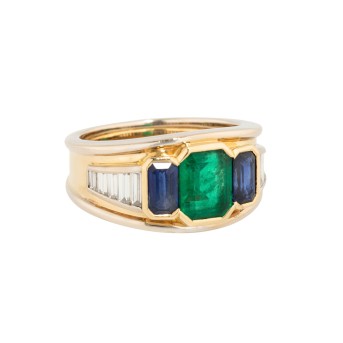 Ring with fine emerald flanked by sapphires