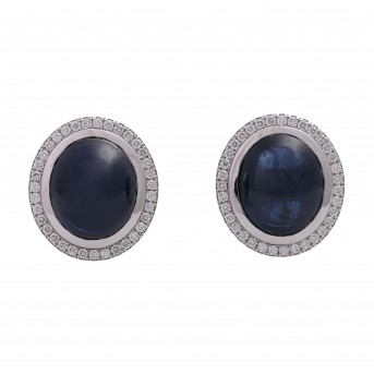 Hochfeine Ohrclipse (Paar). Bes. mit 2 Saphir-Cabochóns 21,24 cts. u. Brill. uis. 0,76 cts. FW/SI.