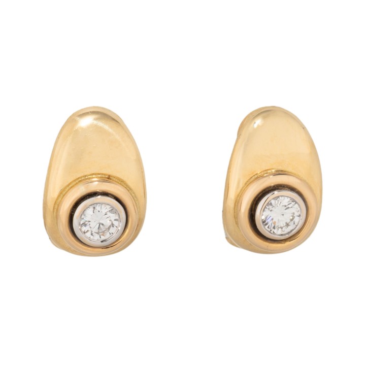Pair of solitaire ear clips with diamonds, 